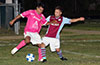 Jose Gutierrez of FC Tuxpan(left) trying to kick the ball before Andy Gonzalez of Maidstone can get it
