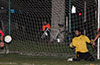 Daniel Valolespirn of Sag Harbor watching the ball go by Jose Morastitla his net