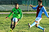 Gerber Garcia of Hampton FC(left) kicking the ball up the field before Michael Garcia of Maidstone can block it