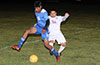 Miguel Bautista of FC Tuxpan(rear) trying to steal the ball from Brian Rojas of Bateman Painting(#16)