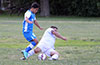 David Rodriguez of Tortorella Pools(left) jumping over the slide tackle of Miguel Bautista of FC Tuxpan