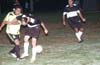 Rene Gutierrez of Maidstone(right) searching for the ball that Juan Carlos of L.I. Rottweilers(left) can not get