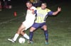 Christian Montes of Bateman(left) holding off a Tuxpan forward