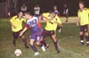 Antonio Padilla of Maidstone(center) trying to get away from Romulo Tubatan(left) and Fabian Arias of Race Lane