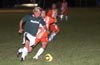 Jeff Esposito of Bayberry and Jason Arias of Tuxpan racing toward the ball