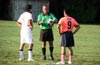Referee Alex Ramierz(center) laying down the law to David Cardona of Bateman(left) and Luis Corea of Maidstone