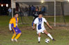 Estuardo Larios of ED-Tuxpan in front of his own goal, watching Jon Lizano of Bateman Painting controlling the ball