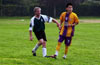 Chris Bottari of Espo(left) cleared the ball before Uchupie Esteban of Tuxpan could get it