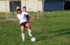 Mike Semkus of Espo(rear) holding off Gehider Garcia of Maidstone