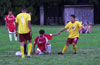 Cesar Correa of Hamptons Arsenal helping Eddie Lopez of Tortorella Pools up