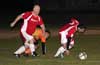 Leslie Czeladko(left) and Stiven Orrego of Tortorella Pools team up to steal the ball from Carlos Torres(rear) of Maidstone Market