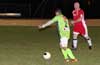 Leslie Czeladko of Tortorella Pools(right) running to block the kick by Estuardo Larios of FC Tuxpan