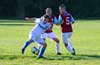 Andy Gonzales of Maidstone Market(front) kicking the ball in front of Alfredo Negrete and Fabian Arias of 75 Main