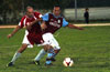 Luis Correa of Maidstone(right) protecting the ball from Rene Gutierrez of Tortorella