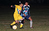 Angel Garces of Bateman Painting(rear) guardinga FC Tuxpan forward