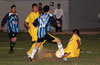 Alberto Carreto of FC Tuxpan(right) sliding to steal the ball from Estaban Uchupaille of Bateman(#10)