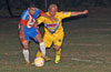 Cesar Correa(left) of The Hideaway holding off Ivan Espinoza of FC Tuxpan