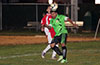 Tono Gonzales of Hampton FC heading the ball in front of Stiven Orrego of Tortorella Pools