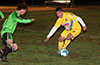 Giovany Espinoza of FC Tuxpan about to take on Marciel Correa of Hampton FC(left)