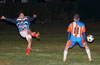 Juan Zuluaga of Bateman(left) kicking the ball past Cristian Rojo of The Hideaway
