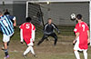 Tortorella keeper, Craig Caiazca watching the ball go wide of the goal post that Julian Munoz(#8) of Bateman shot