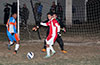 David Rodriguez of Tortorella in front of The Hideaway goal with keeper Olger Araya keeping an eye on the ball