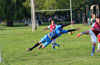 Jefferson Ramirez(right) of Maidstone kicking the ball past the hands of Cristian Rios of Bateman to teamate Gehider Garcia