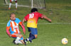 Nettie Sanchez of FC Tuxpan(#10) running past Alfredo Negrete of The Hideaway
