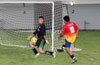 Nettie Sanchez of FC Tuxpan taking a shot against Duvan Castro of Hampton FC