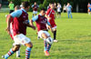 Jefferson Ramirez(center) of Maidstone Market about to chip the ball to Gehider Garcia of Maidstone(front)