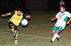 Juan Zuluaga of Bateman Painting(left) blasting the ball past Orlando Bautista of FC Tuxpan