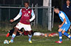 John Adeseko of Maidstone(left) deciding on how to protect the ball from Stiven Orrego of Tortorella