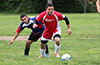 Alex Mesa of Tortorella Pools(front) beating Mario Olaya of Maidstone Market(rear) to the ball