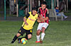 Jonathan Lizano of Bateman Painting(left) about to dribble past Cristian Penafiel of Cuenca FC