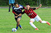 Mathew Ramirez of Maidstone(left) holding onto Esteban Uchupaille of Cuenca FC