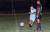 Danny Salazar of Hampton FC, kicking the ball past Julian Barahona of Maidstone