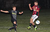 Andy Gonzalez of Maidstone Market, blasting the ball past Juan Guzman of Sag Harbor