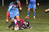 Mario Olaya of Maidstone sliding to steal the ball from Jonathan Lizano of Bateman