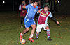 Juan Zuluaga of Bateman holding off Andy Gonzalez of Maidstone
