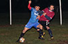 Jonathan Lizano of Bateman holding off Luis Correa of Maidstone(rear)