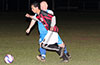 Henry Perez of Sag Harbor(front) trying to get by Leslie Czeladko of Tortorella Pools