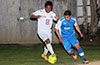 Cesar Correa of Tortorella Pools(right) about to get by Alberto Correto of FC Tuxpan