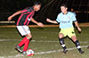 Matthew Rojano of Sag Harbor(left) taking on Clinton Perez of Hampton FC