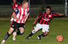 Andriy Pozdniakov of Bateman Painting(left) and Pedro Cristobal of Sag Harbor racing toward the ball