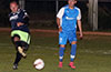 QuiQue Araya, Hampton FC(left) blasting the ball past Esteban Uchupaille of Tortorella Pools