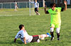 Romulo Tubatan of Bateman Painting sliding to steal the ball from Oscar Reinoso of Hampton FC