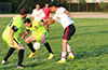 Danny Salazar of Hampton FC protecting the ball between his legs from Oscar Galvis of Bateman Painting(right), with Jose Almansa watching