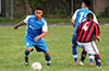 Diego Guazhambo of Tortorella Pools(left) dribbling past a Sag Harbor forward