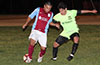 Mario Olaya of Maidstone Market(left) holding the ball away from Luis Aguilar of FC Tuxpan