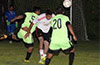 Jonathan Lizano of Bateman Painting(center) heading the ball out of danger